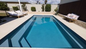 Brampton 8.2m x 4.2m fibreglass pool in a hampton grey shimmer finish