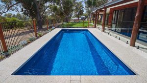 Brampton 8.2m x 4.4m fibreglass pool in a royal jade shimmer finish