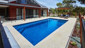 Brampton 8.2m x 4.4m fibreglass pool in a royal jade shimmer finish