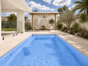Cyprus Blue Shimmer fibreglass pool with Mediterranean-style landscaping and alfresco area in Perth